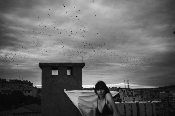 Girl on rooftop, black and white
